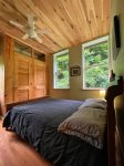 A back bedroom tucked away with a great forested view.  